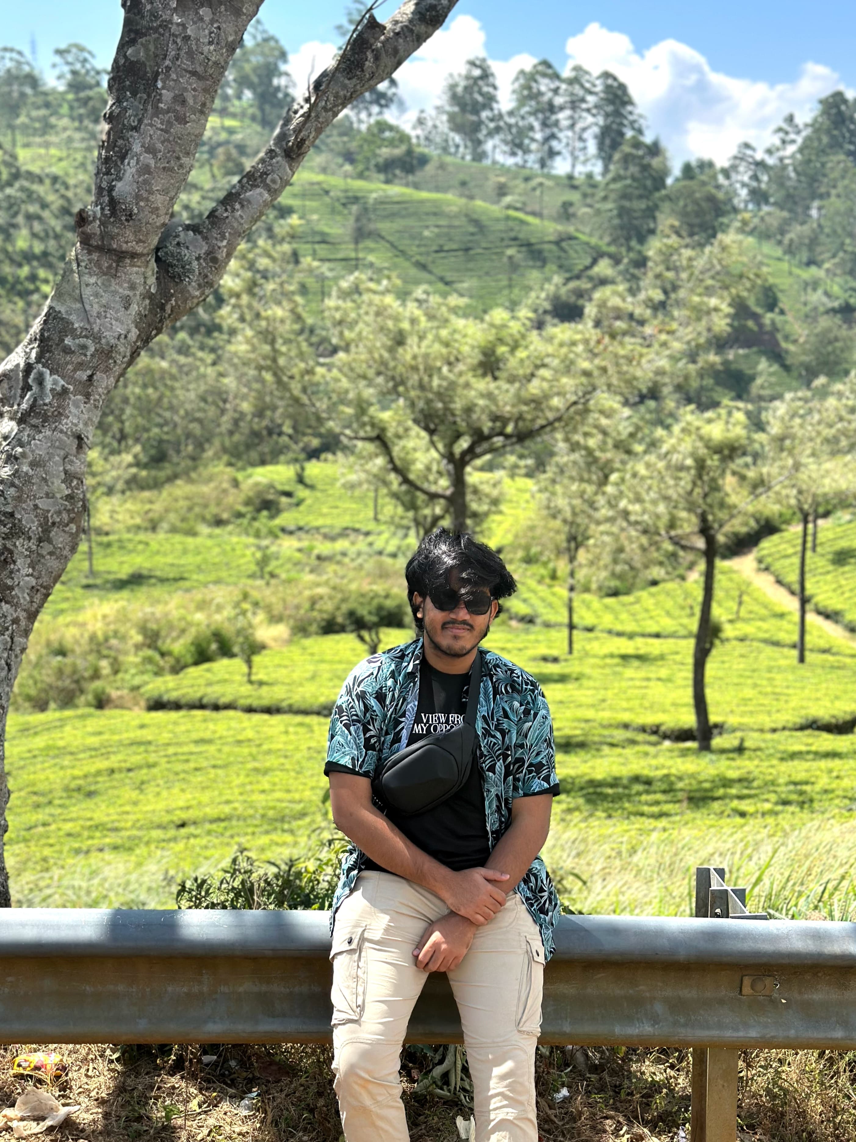 Muhtasin Jawad sitting in a green tea garden