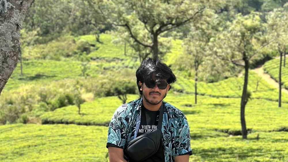 Muhtasin Jawad sitting in a green tea garden