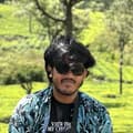 Muhtasin Jawad sitting in a green tea garden